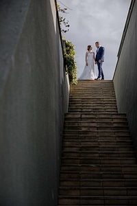 Groom bride stairs photo