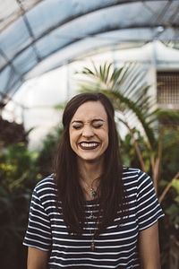Brunette Laughing with Closed Eyes photo