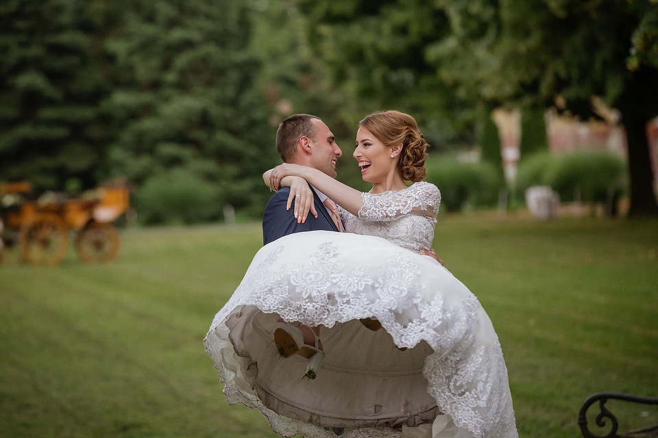 Groom holding bride
