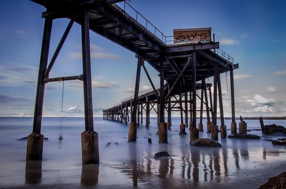 Long Exposure Seaside View with a Long Pier photo