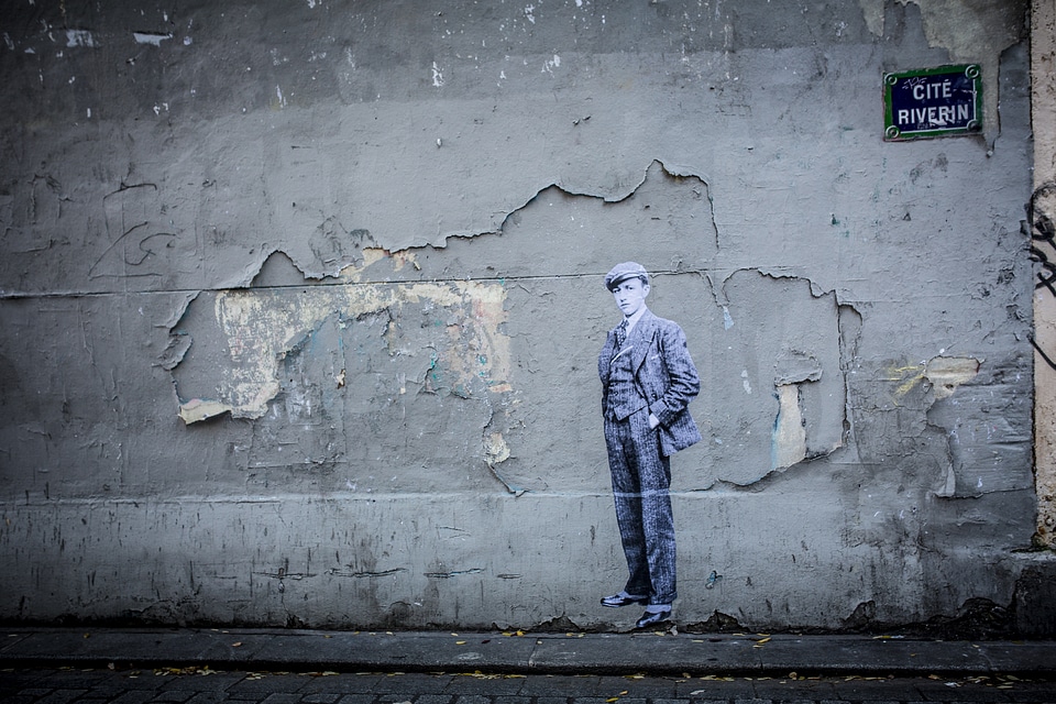 Grunge Peeling Wall with a Boy Painted on