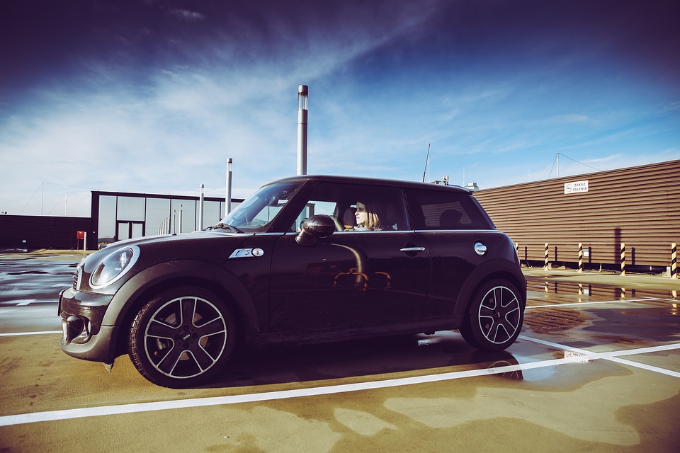 Woman Sitting in Black Mini Cooper