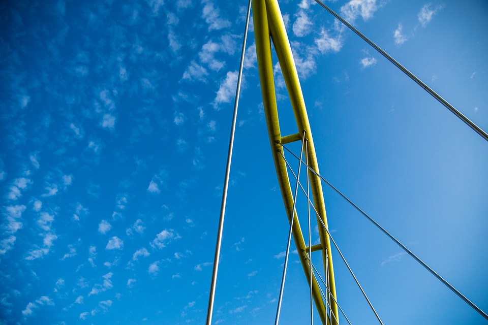 View of Yellow Bridge Elements against a Blue Sky photo