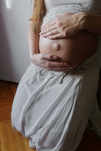 Young Woman pregnant belly photo