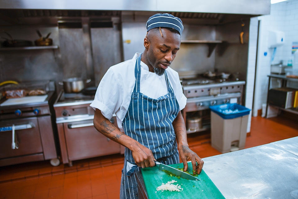 Chef Cutting Vegetables for Cooking photo