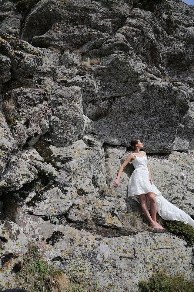 Bride rock climbing posing