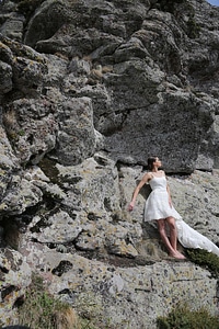 Bride rock climbing posing photo