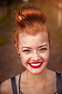 Closeup Portrait of Redhead Girl with Brown Eyes and Freckles, Natural Beauty photo