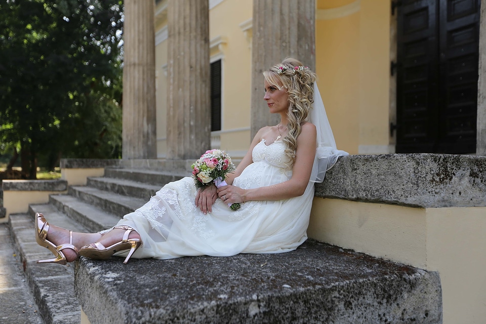 Pregnant bride posing