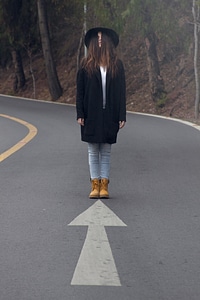 Young Girl Standing in the Middle of the Road photo