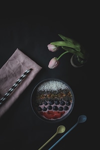 Acai Berry Smoothie Bowl Topped with Chia Seeds, Coconut Flakes, Strawberries and Berries photo