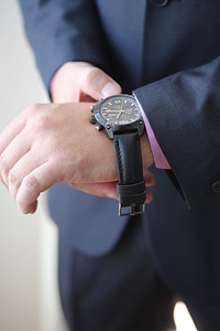 Wristwatch hands suit photo