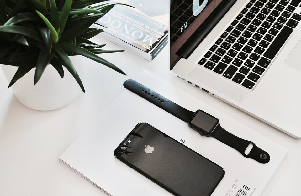 Laptop, Smartphone and Watch on White Table