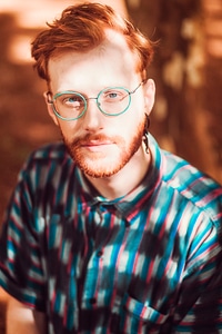 Redhead Guy Wearing Green Glasses photo