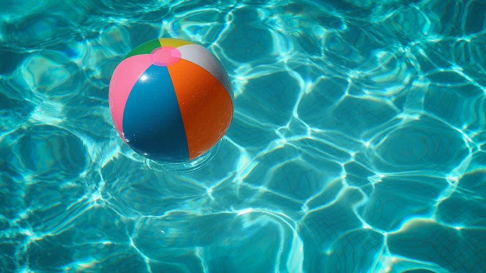 Colorful Beach Ball Floating on Water