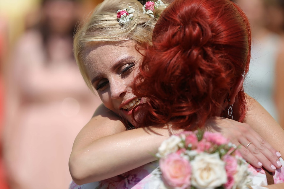 Women blonde hair hugging