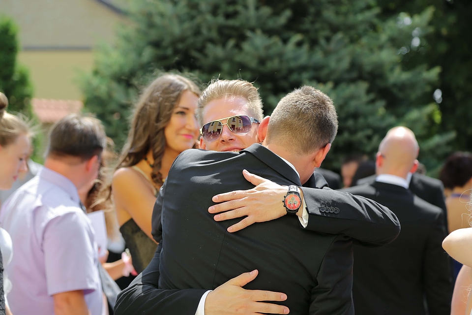 Men businessperson hugging