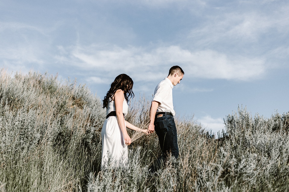 Couple Holding Hands Walking Away
