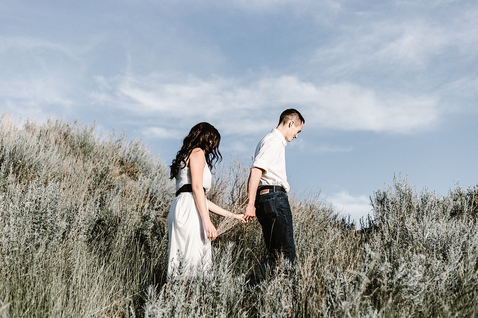 Couple Holding Hands Walking Away photo