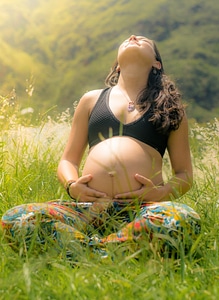 Young Pregnant Woman Is Enjoying Summer Sun photo