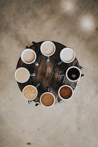 Eight Kinds of Coffee on a Round Wooden Table photo