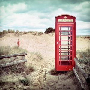 Retro English Red Phone Box on the Beach photo
