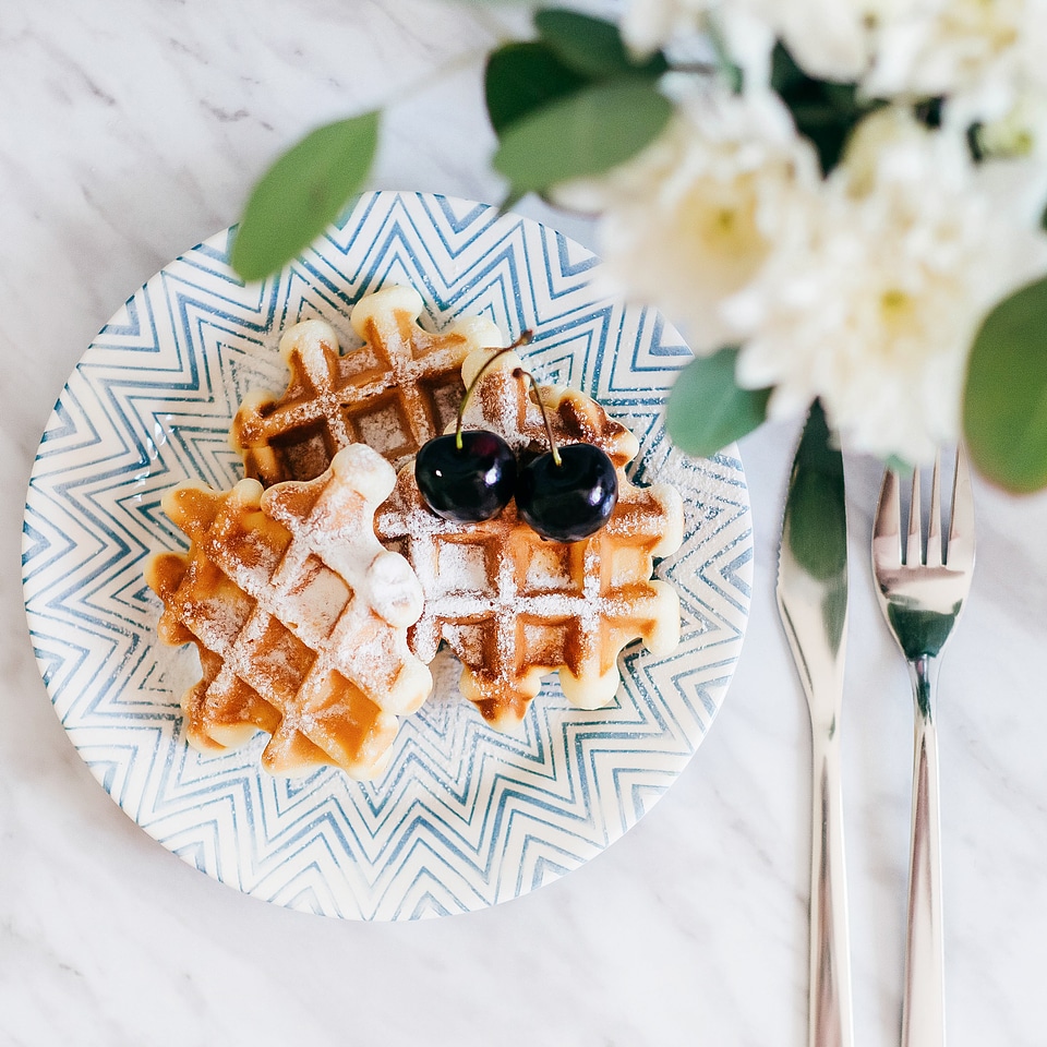 Fresh Belgian Waffles Sprinkled with Powdered Sugar