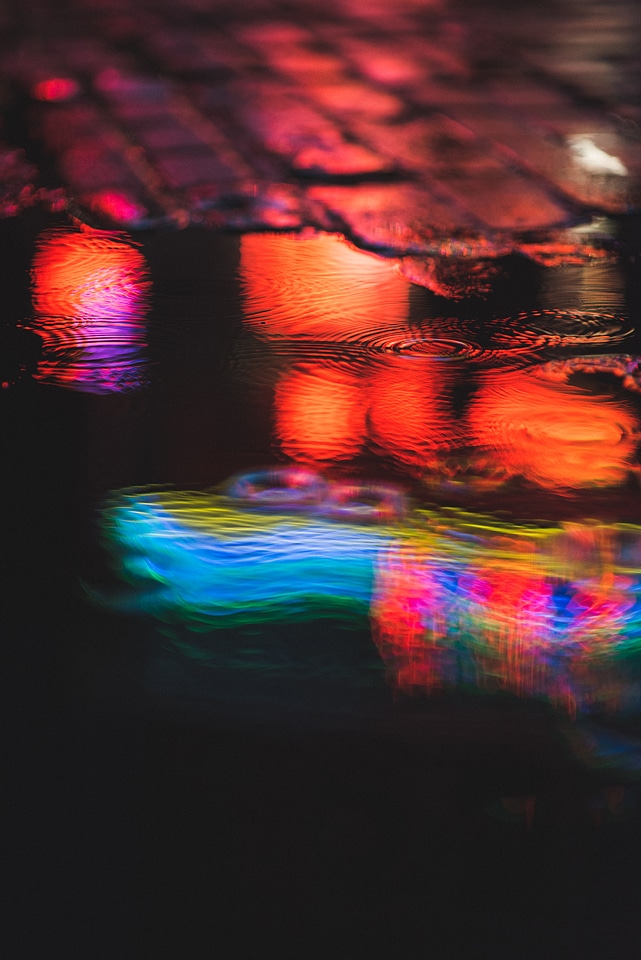 Colorful Lights Bouncing in the Puddle at Night