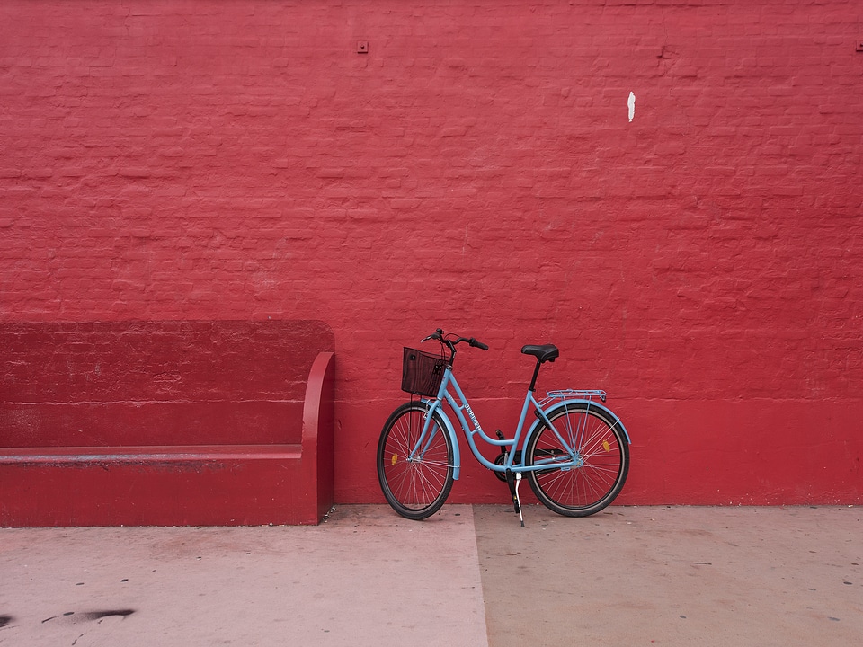 Blue Bicycle against Red Brick Wall photo