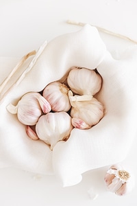 Garlic Cloves and Bulbs in a White Cloth photo