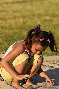 Child pretty girl playing
