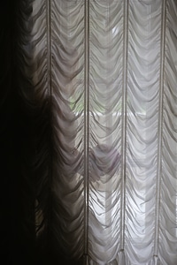Woman curtain window