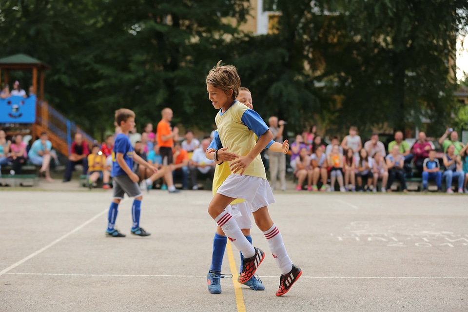 Soccer hug football player