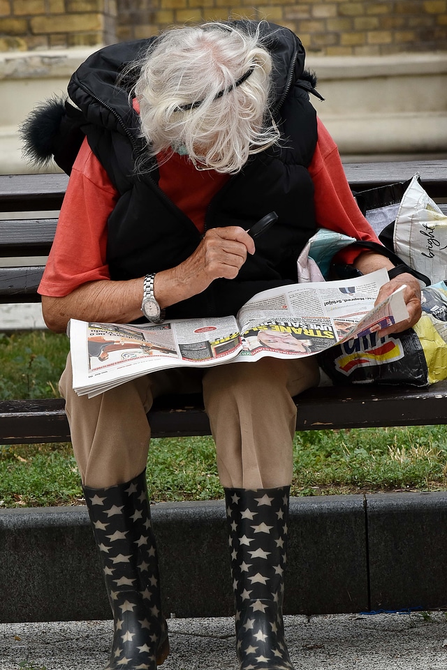 Elderly newspaper reading