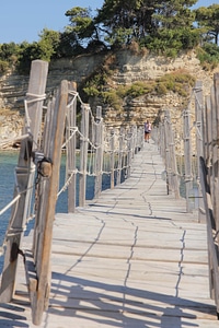 Tropical handmade suspension bridge photo