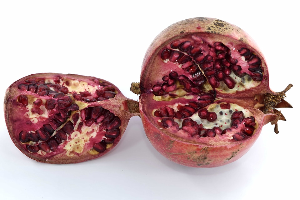 Eating pomegranate ripe fruit