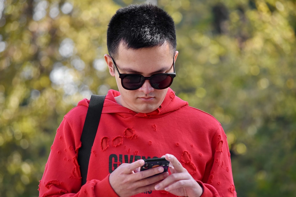 Asian boy cellphone