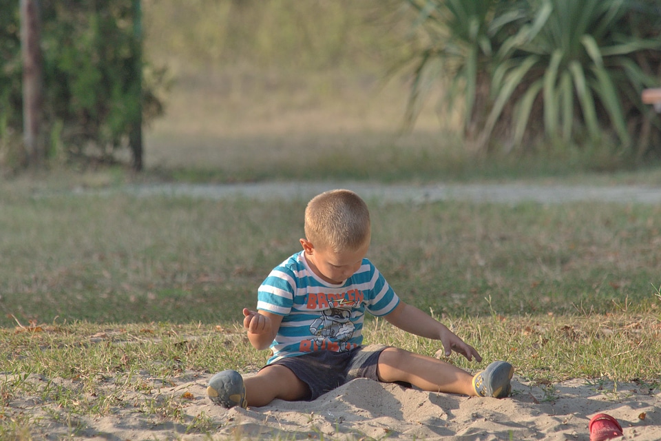 Boy playground sand photo