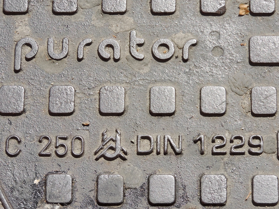 Alphabet cast iron manhole cover
