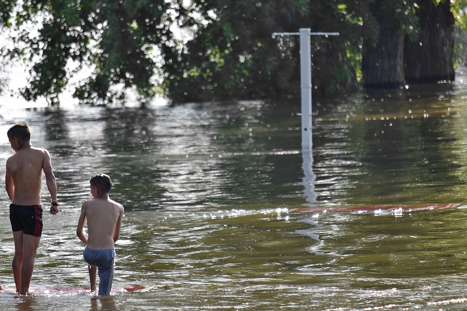 Boys flood landscape