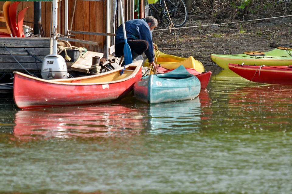 Canoe man riverbank