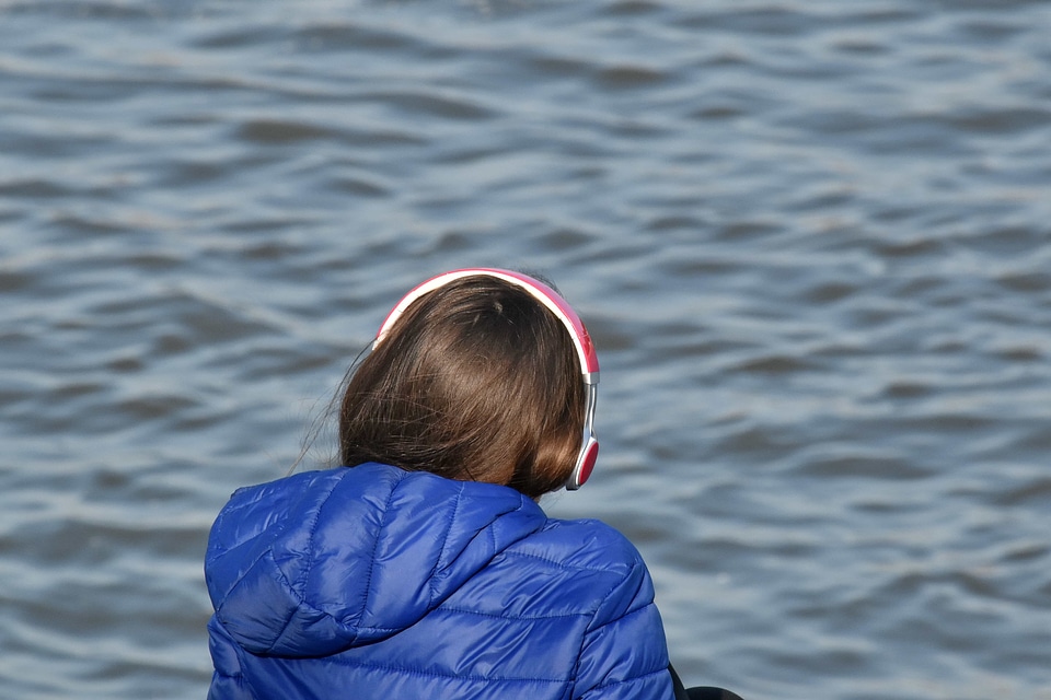 Earphones woman beach photo