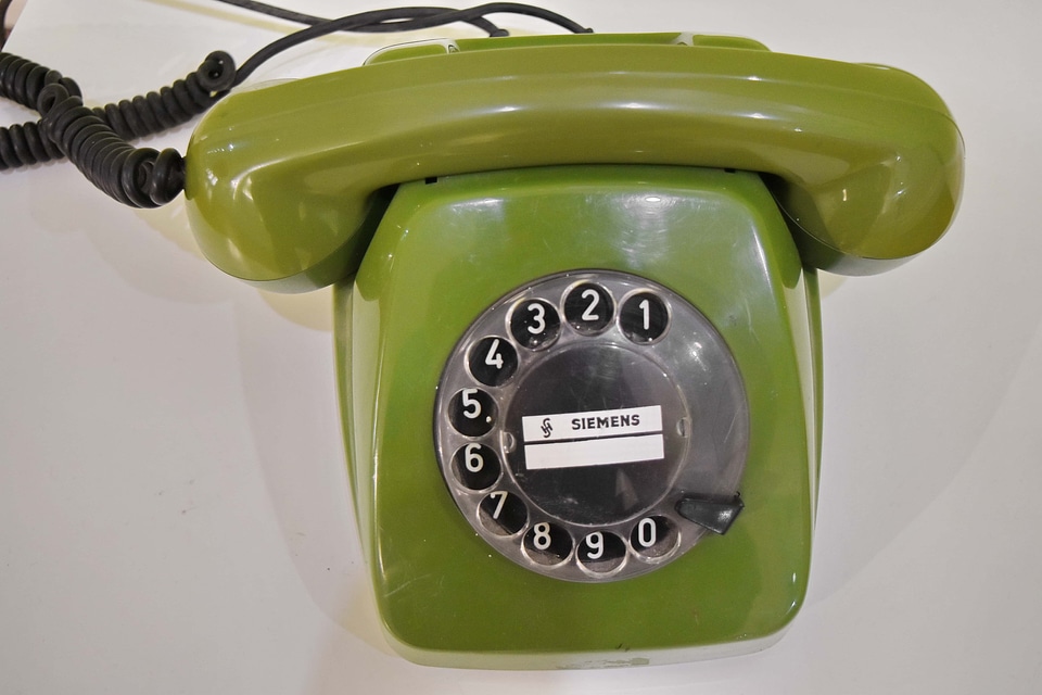 Antiquity greenish yellow telephone
