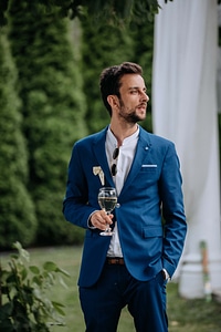 Businessman drinking white wine photo