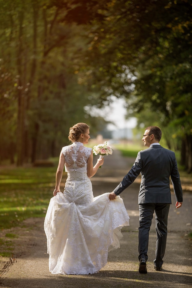 Walking smiling newlyweds