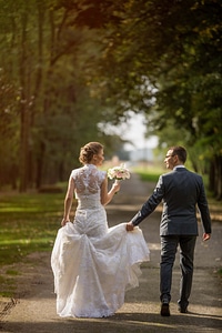 Walking smiling newlyweds photo