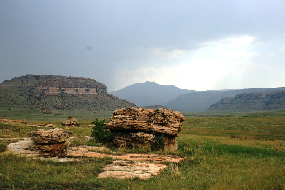 Eminent storm faroff mountains green grass