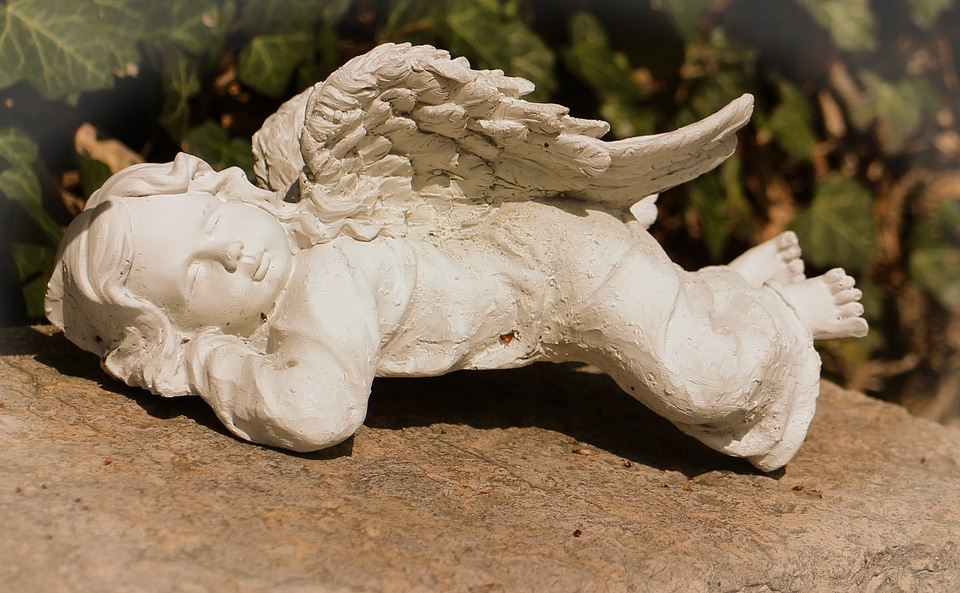 Sleeping dreaming stone figure