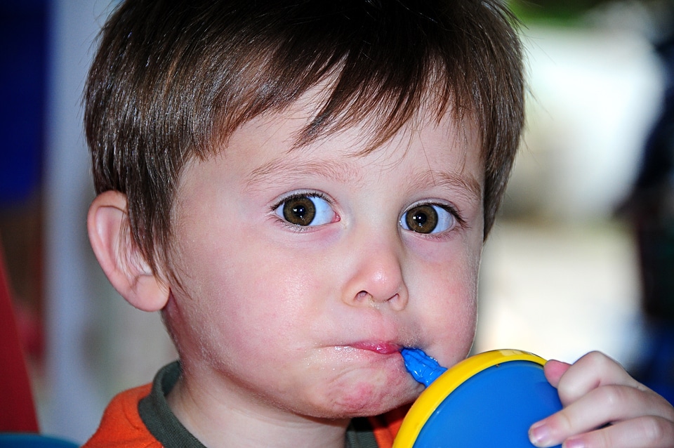 Child big eyes drinking