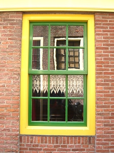 Yellow green reflection in the window photo